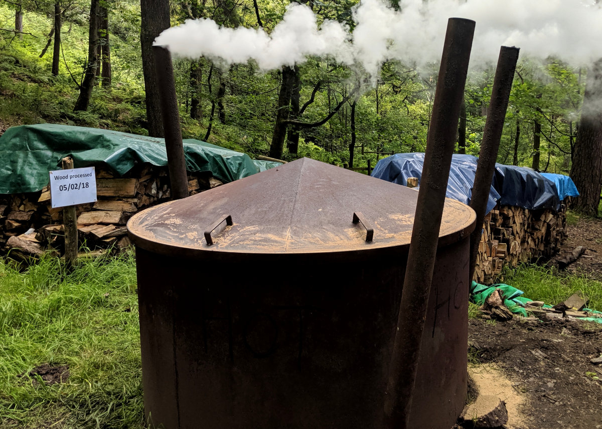 Making charcoal to profit from the land